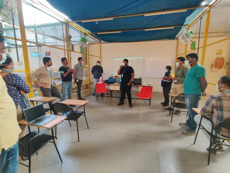 Wide view of a corporate HSE training room mid-session