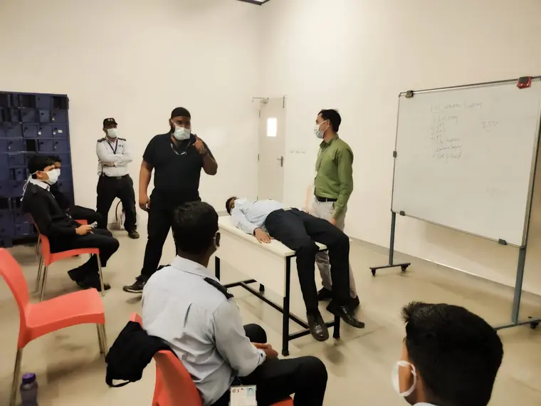 Advanced first aid demonstration in front of a training group